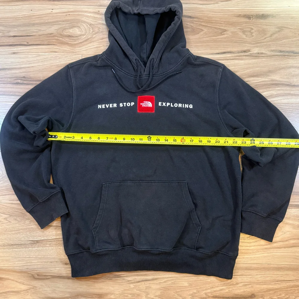 The North Face Black Hoodie with Red Logo Patch